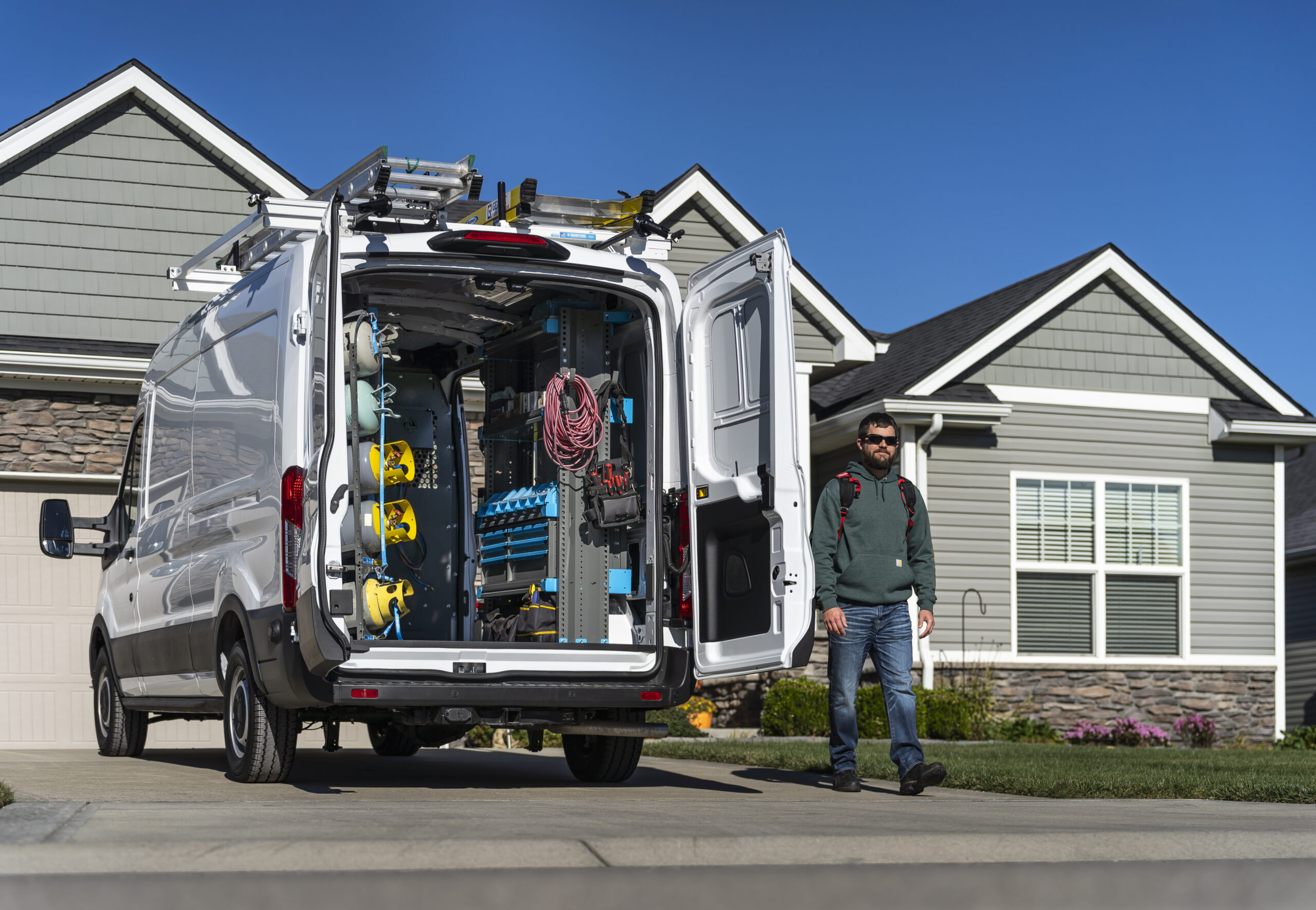 USA Plumbing service van parked at a residential job